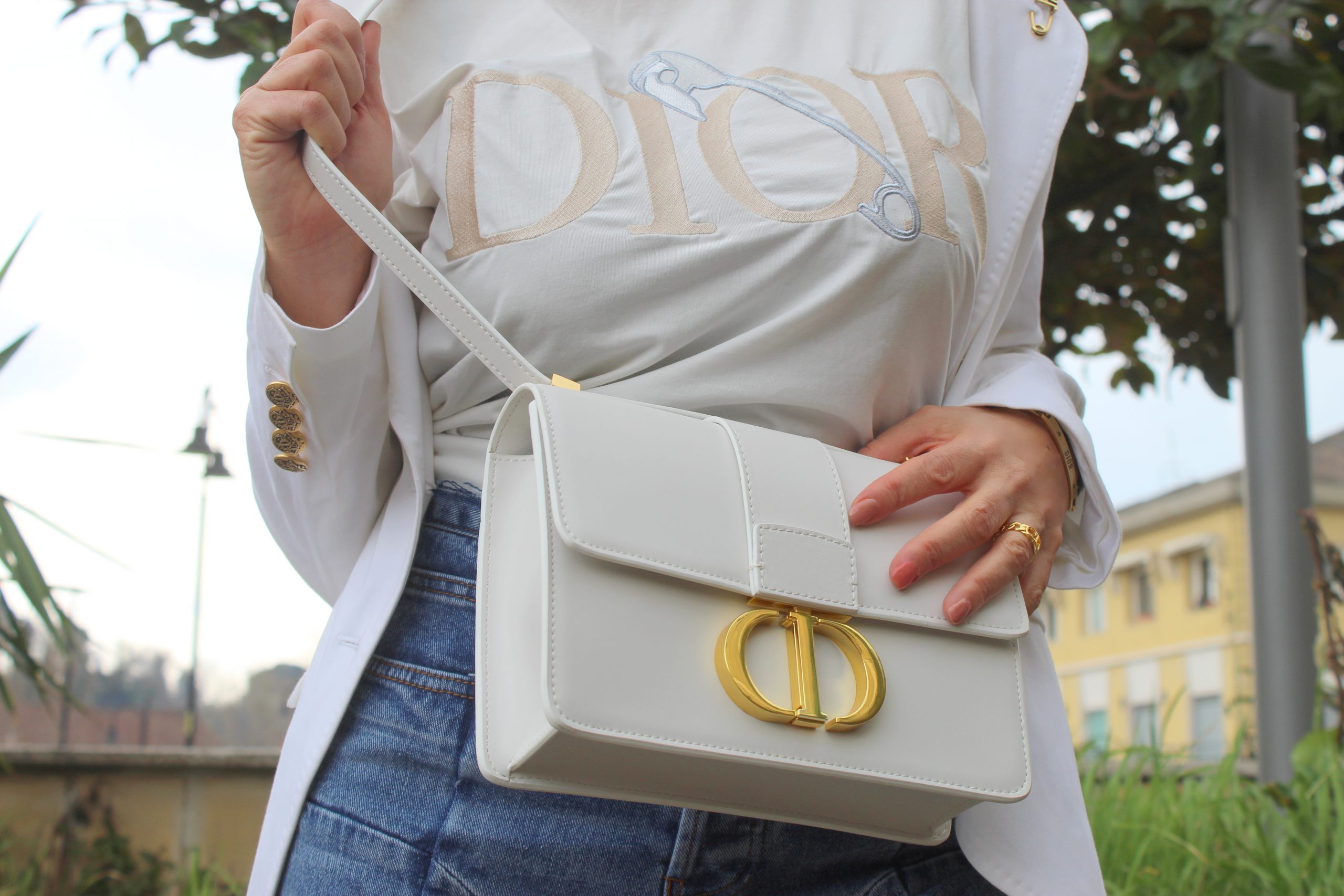 Joggers white and jeans combo Dior accessories gold details Spring Trend Paola Lauretano