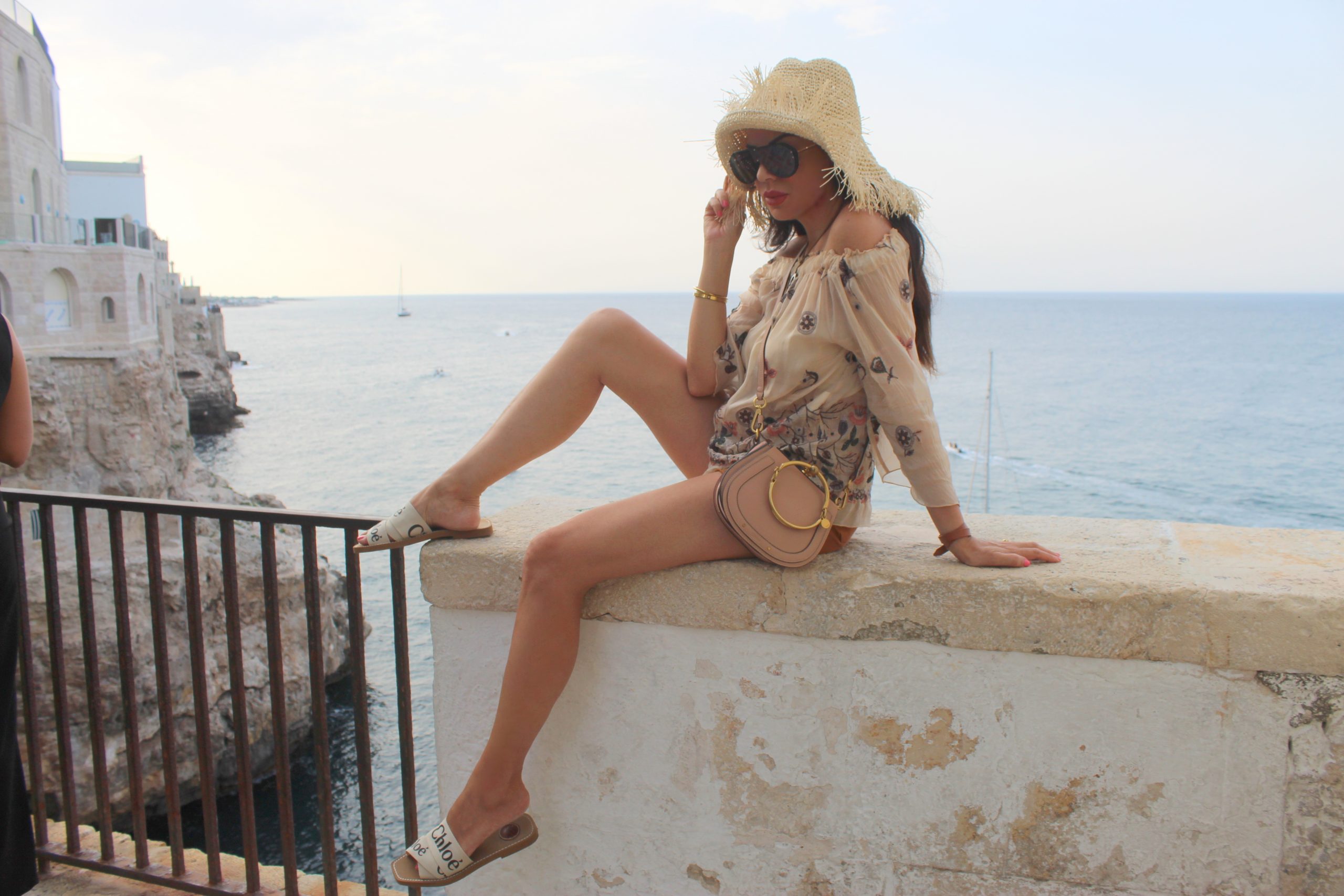 Italian Summer Vacation Outfit Inspo Ideas Polignano a Mare Puglia Travel Trend Paola Lauretano