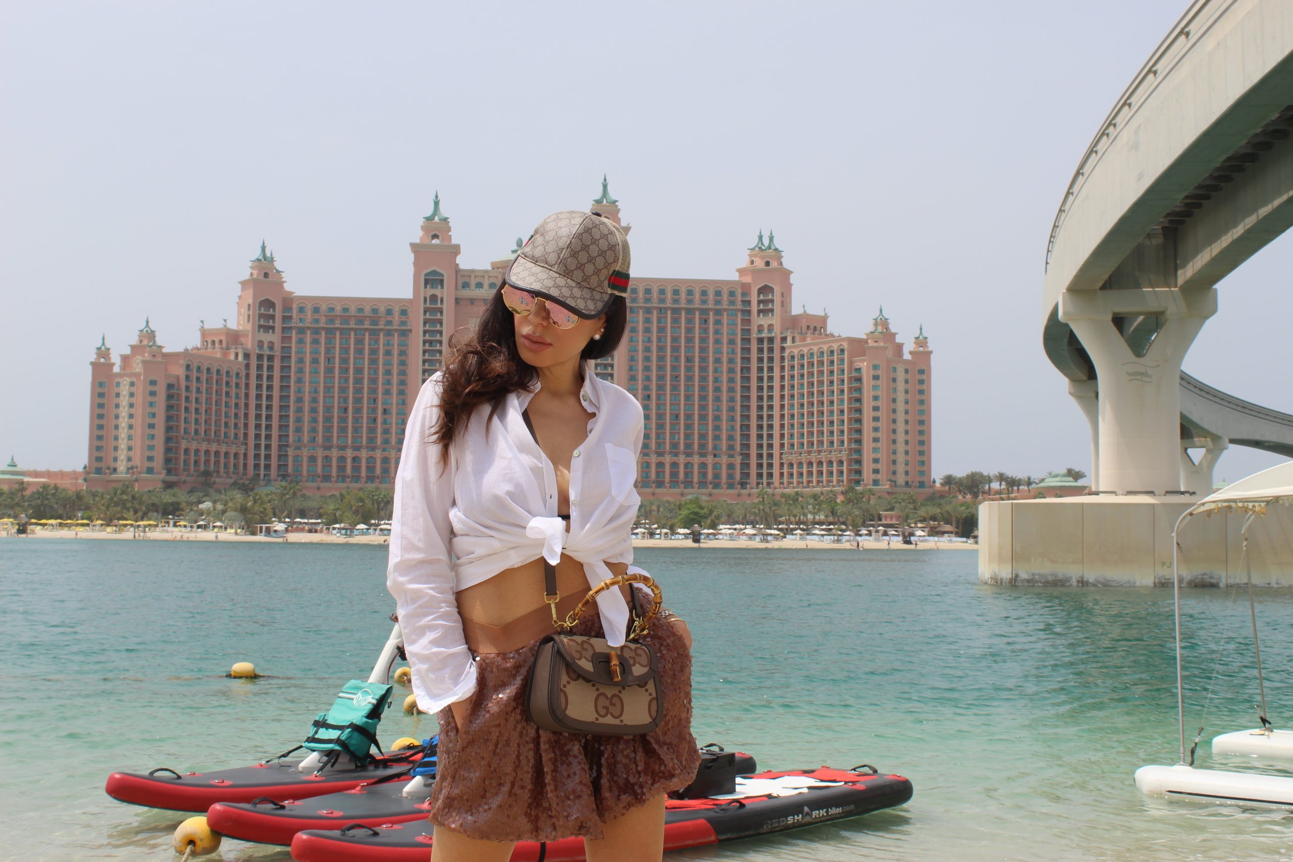 THE POINTE PALM JUMEIRAH Dubai Travel KATIA GIANNINI shirt MARIUCCIA MILANO shorts GUCCI bikini, cap and bag CHANEL sandals Paola Lauretano