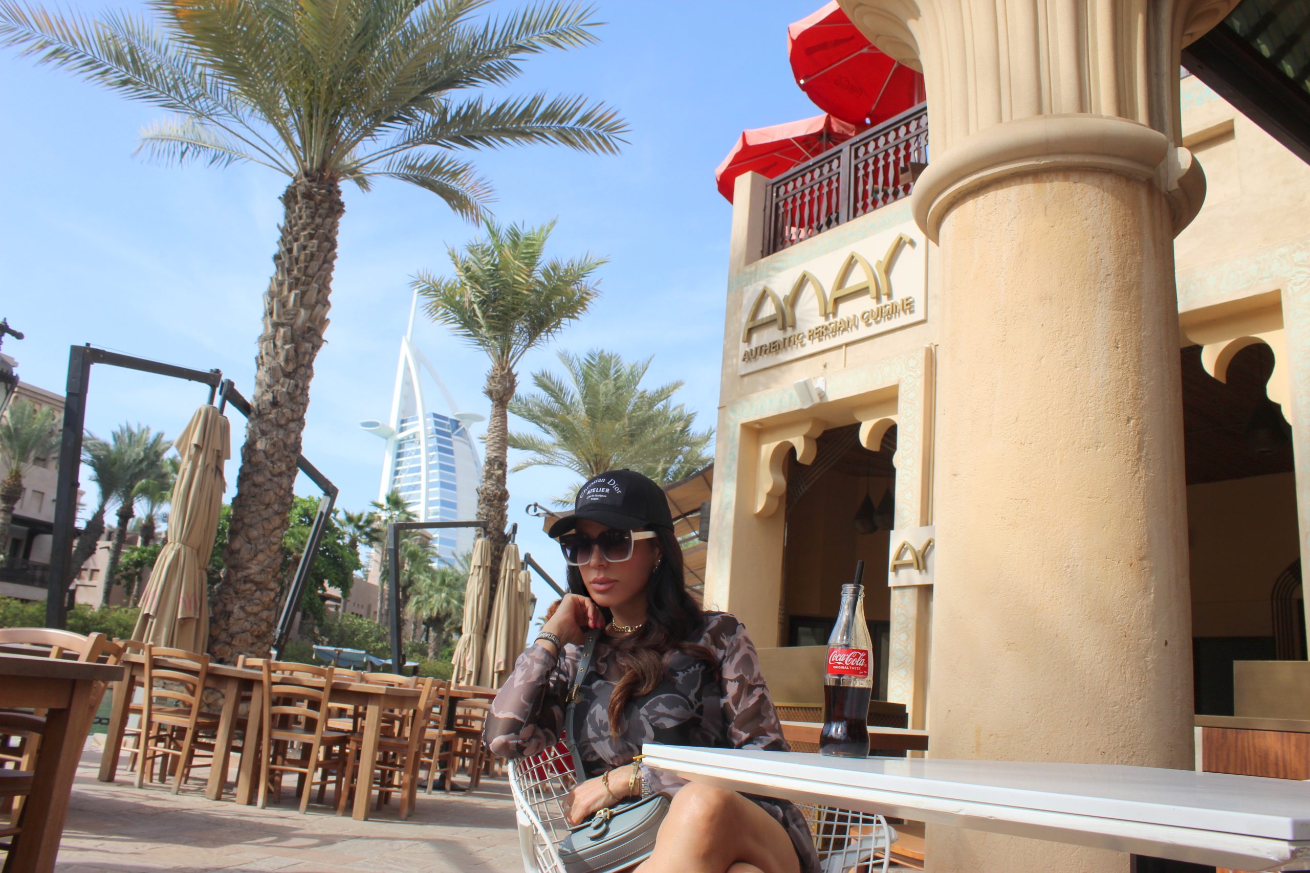 Arabic Style at MADINAT JUMEIRAH MERCI blouse and shorts  DIOR cap, sunglasses, jewelry, belt and bag CHANEL sandals Paola Lauretano Lifestyle Blogger
